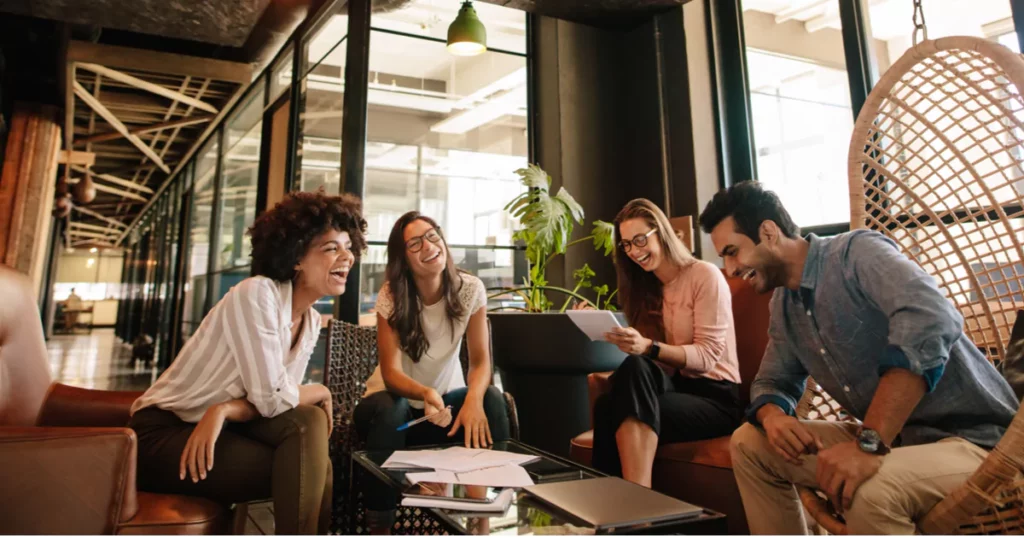 people laughing in a well-decorated office