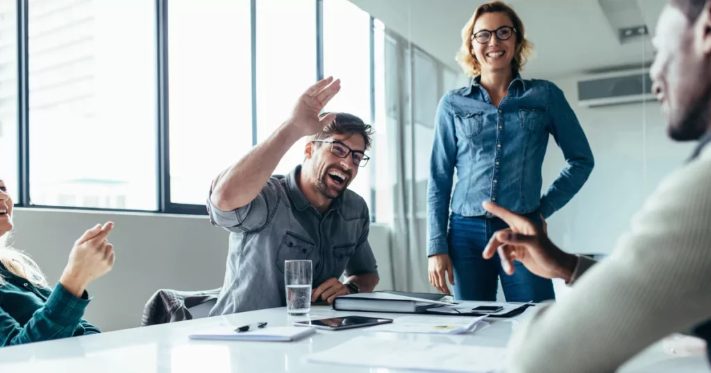 Team members laughing in an office