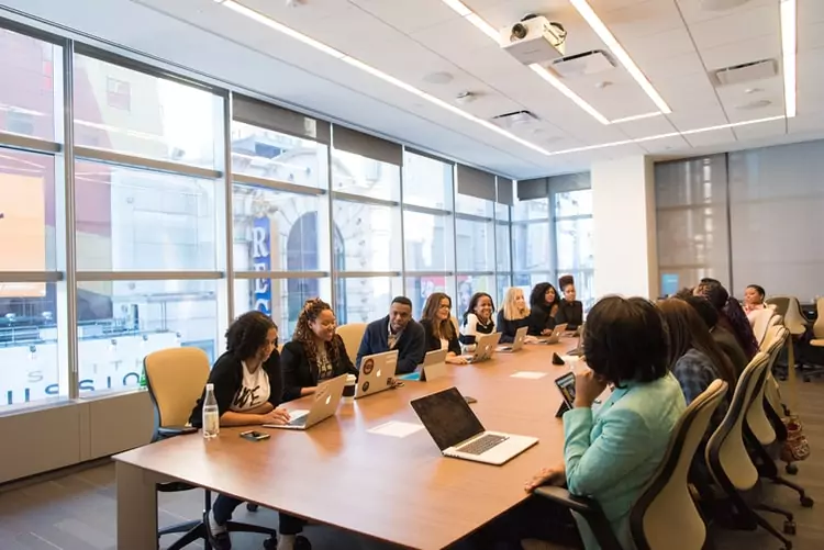 People in boardroom around conference table