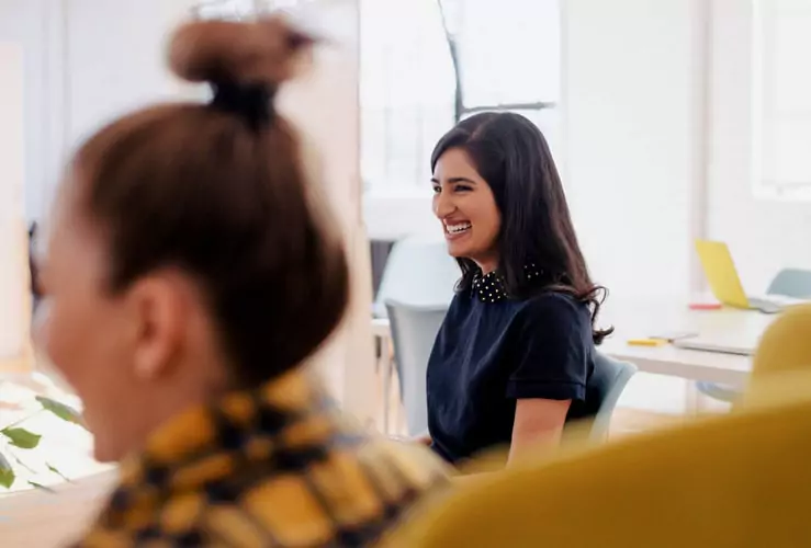 woman laughing in a meeting