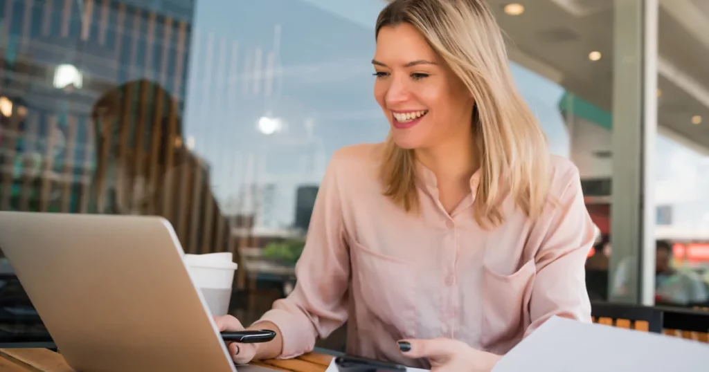 Smiling woman on laptop