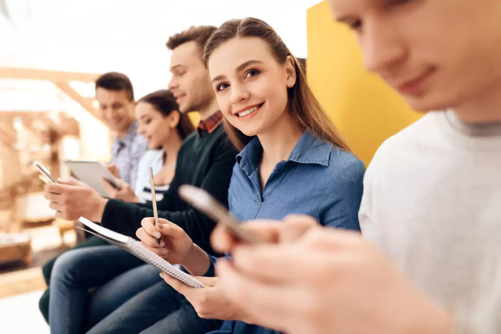 woman taking a team building personality test with a notebook and pencil