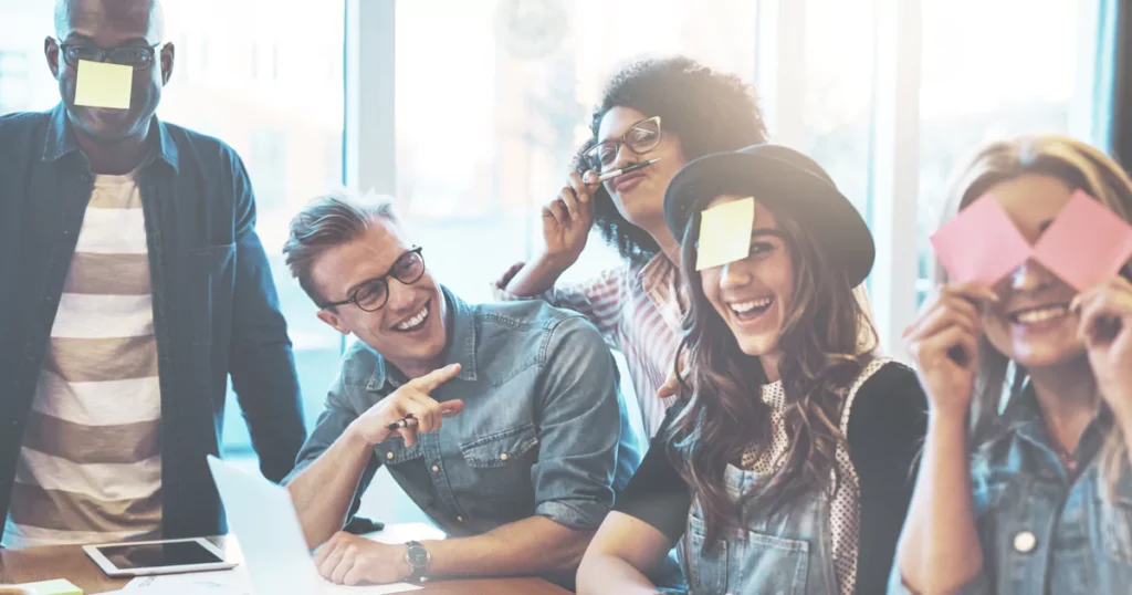 coworkers in an office setting doing quick team building activity