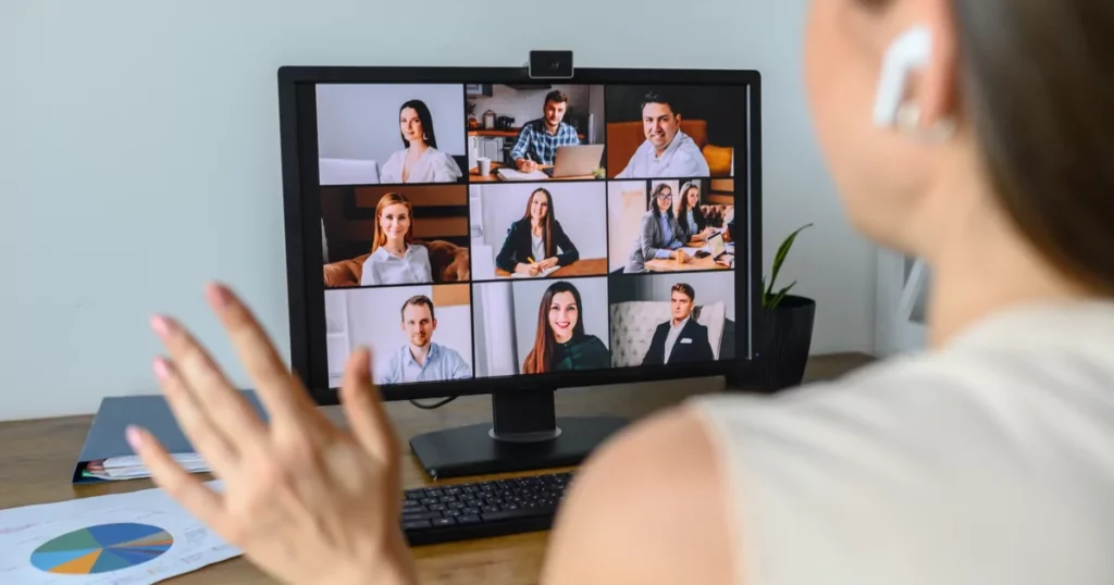 Woman on a zoom call waving