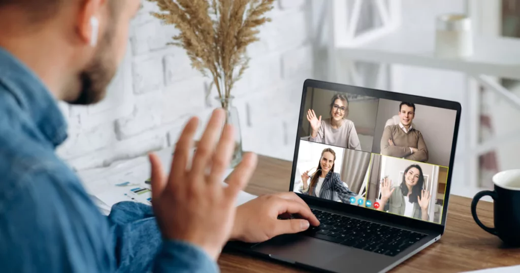 man waving on a zoom call