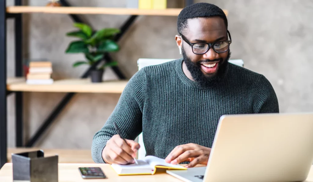 man-smiling-at-computer