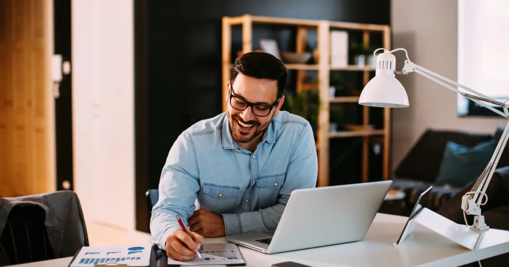 smiling-man-laptop-home-offic