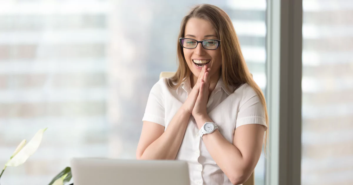 smiling woman clasped hands