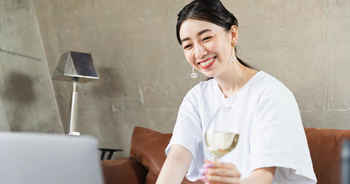 smiling woman wine white shirt