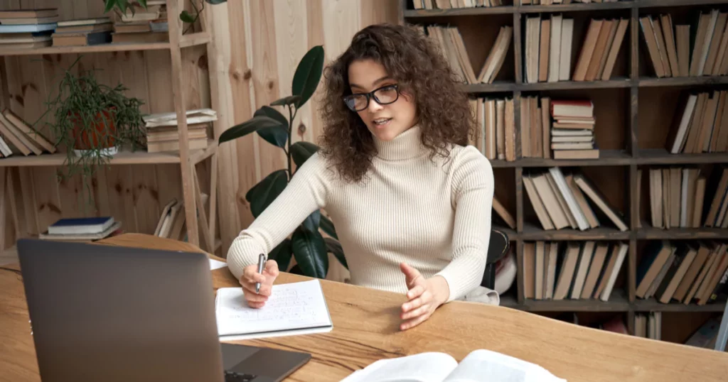 woman-glasses-laptop-books