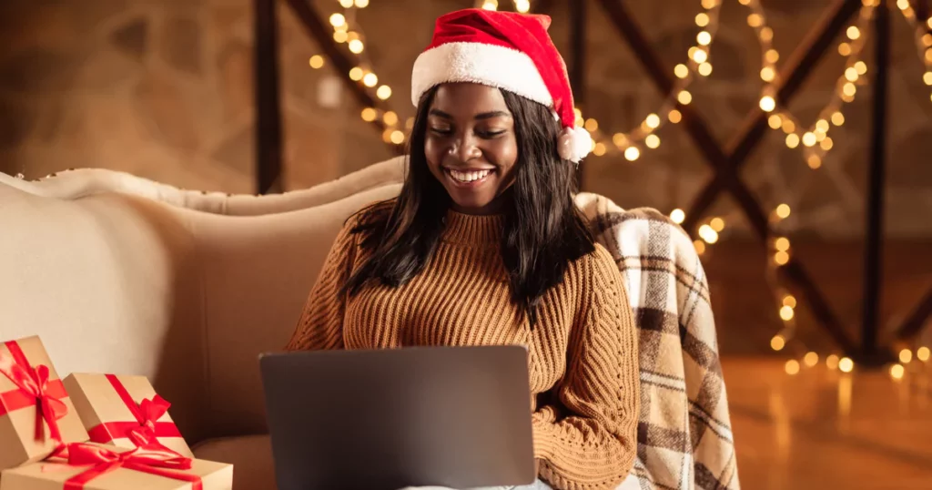 woman-santa-hat-laptop-lights