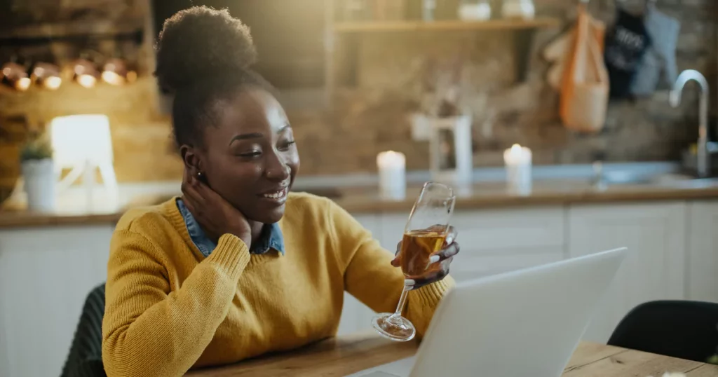 woman yellow sweater wine