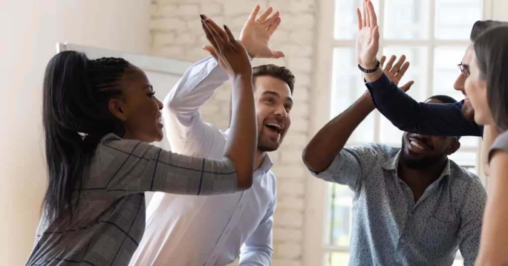 high-fiving-team-members