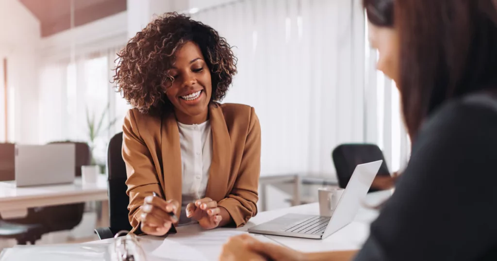 hr-professional-brown-blazer-talking-office