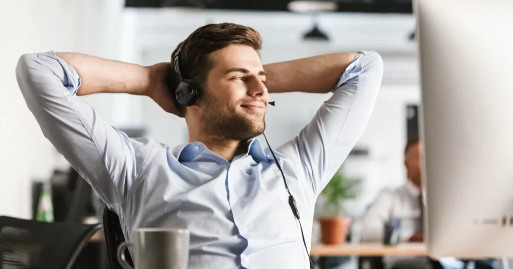 man-headset-button-up-smile-lean-back