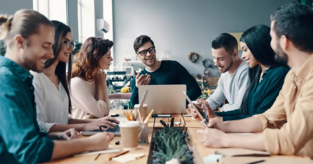 office-team-conference-table-smiles-diverse