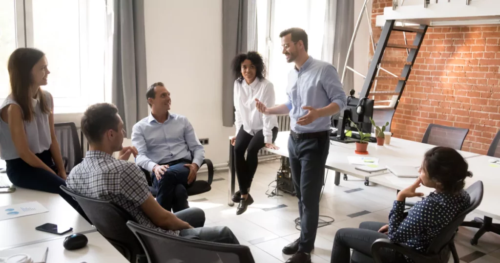 team-lead-man-office-button-up-glasses-standing