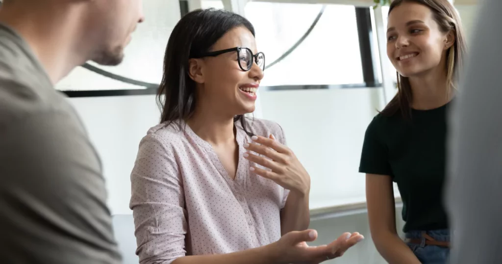 laughing-woman-glasses-office-sharing