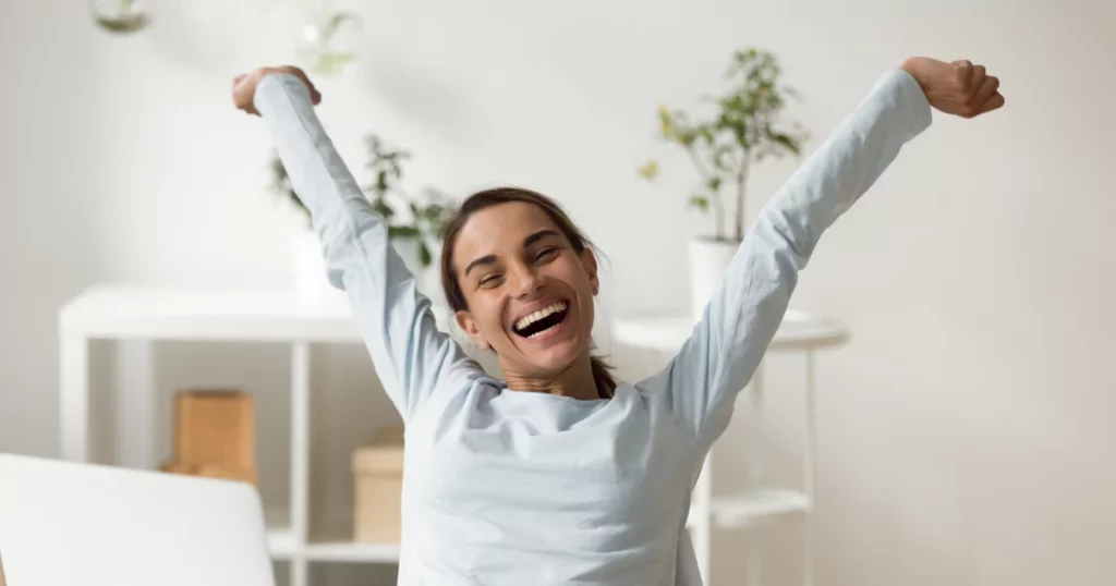 woman-stretching-desk-smile