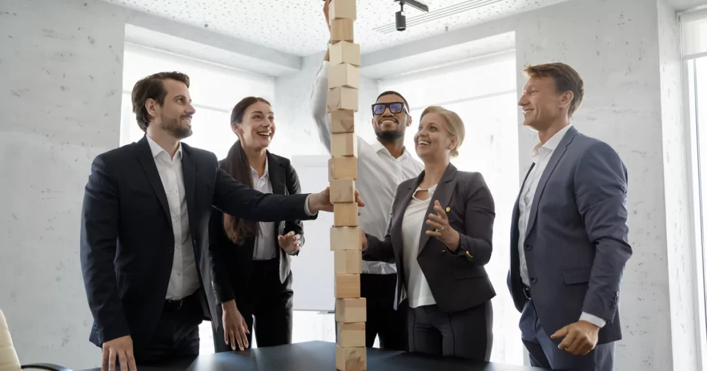 employees building wooden tower