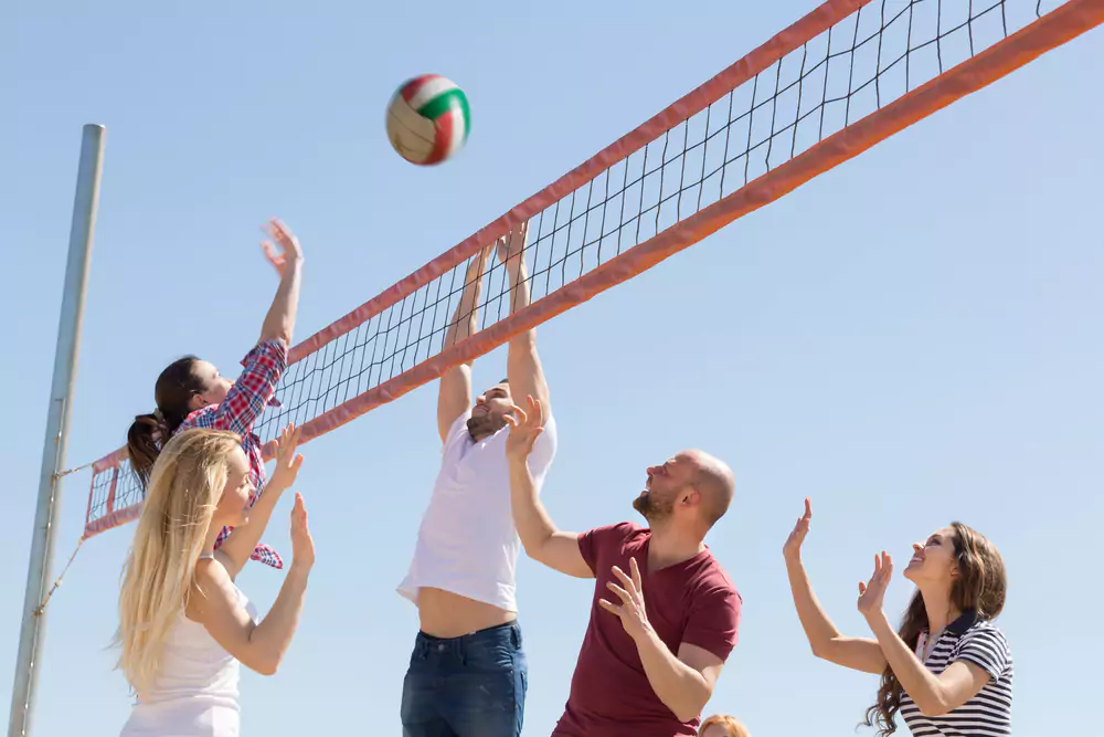 employees playing volleyball
