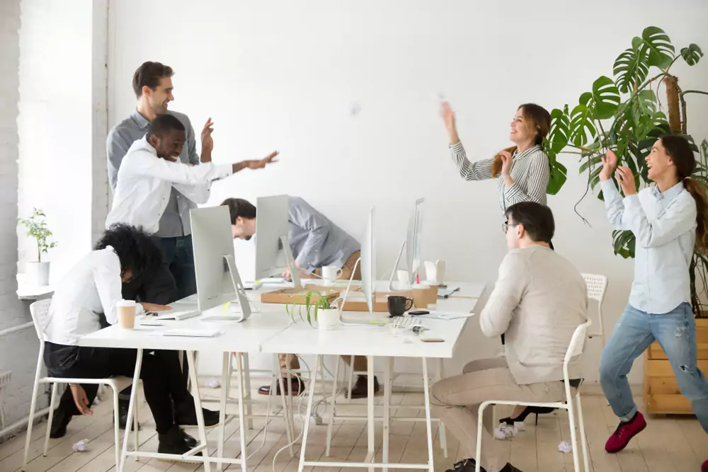 employees-throwing-things-in-office