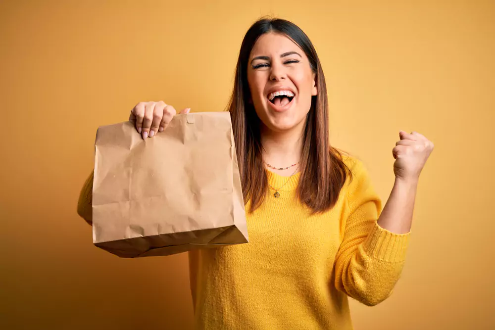 employee celebrating getting take away for lunch