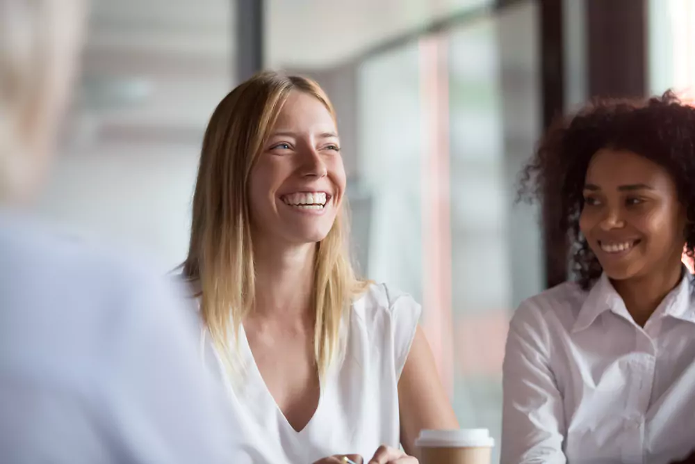 employee smiling in a group