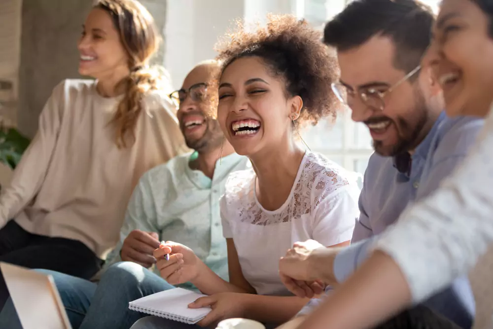 employees laughing in meeting