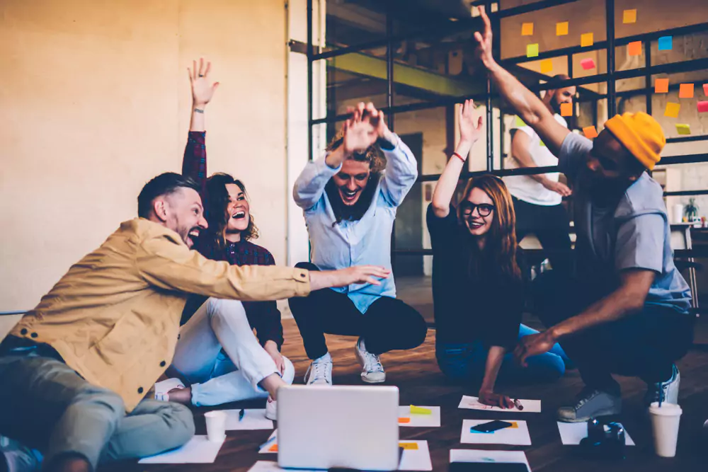 employees laughing on the floor