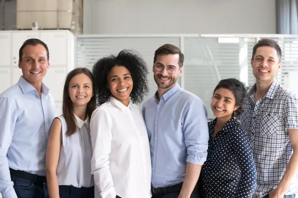 group of employees smiling at camera