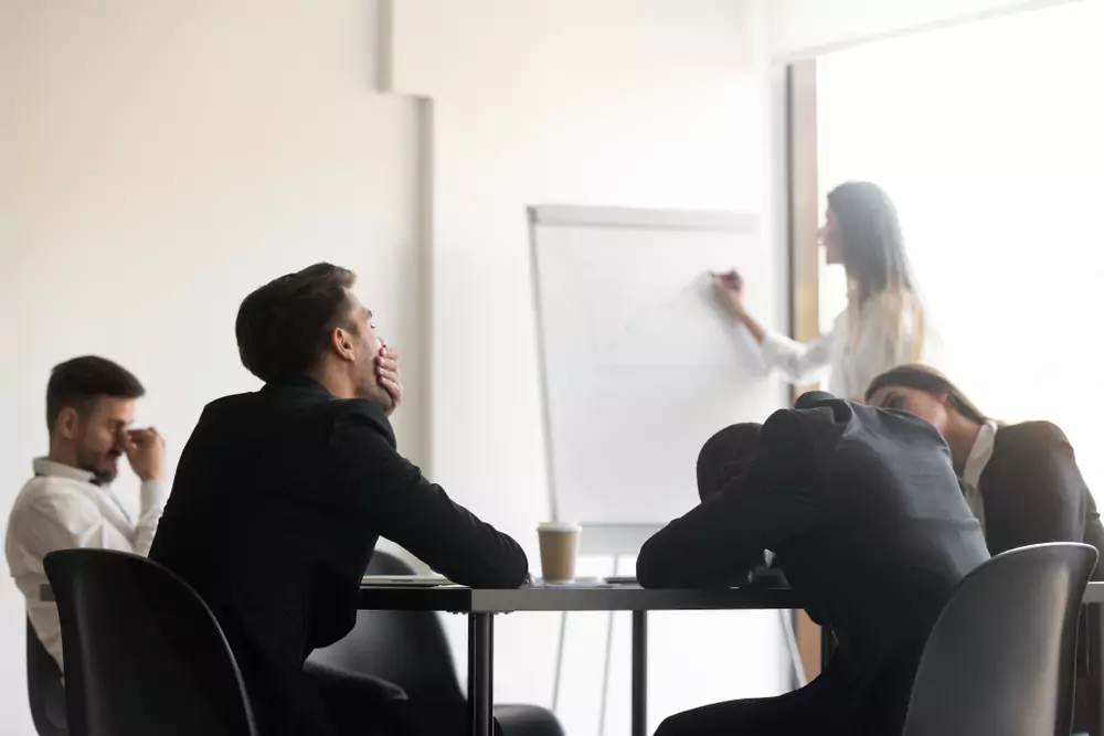 tired employees in meeting