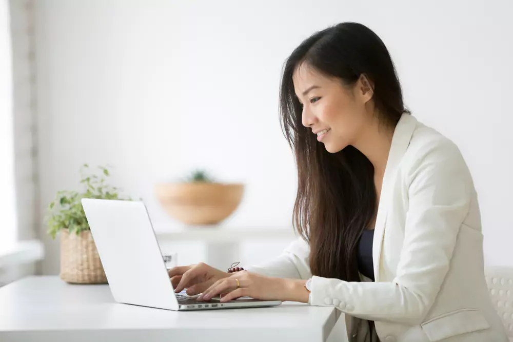 woman looking at laptop