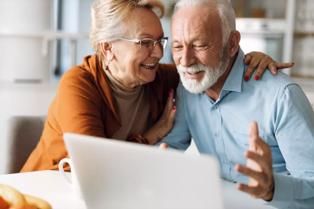 retired couple laughing at meme
