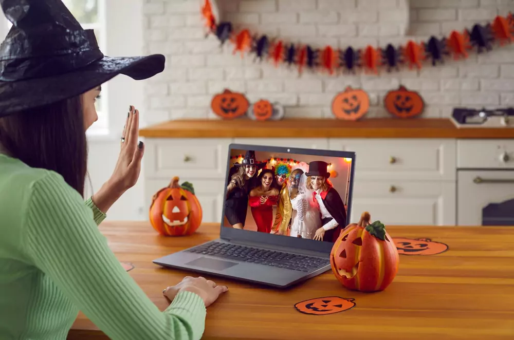 team member logging on to virtual halloween party