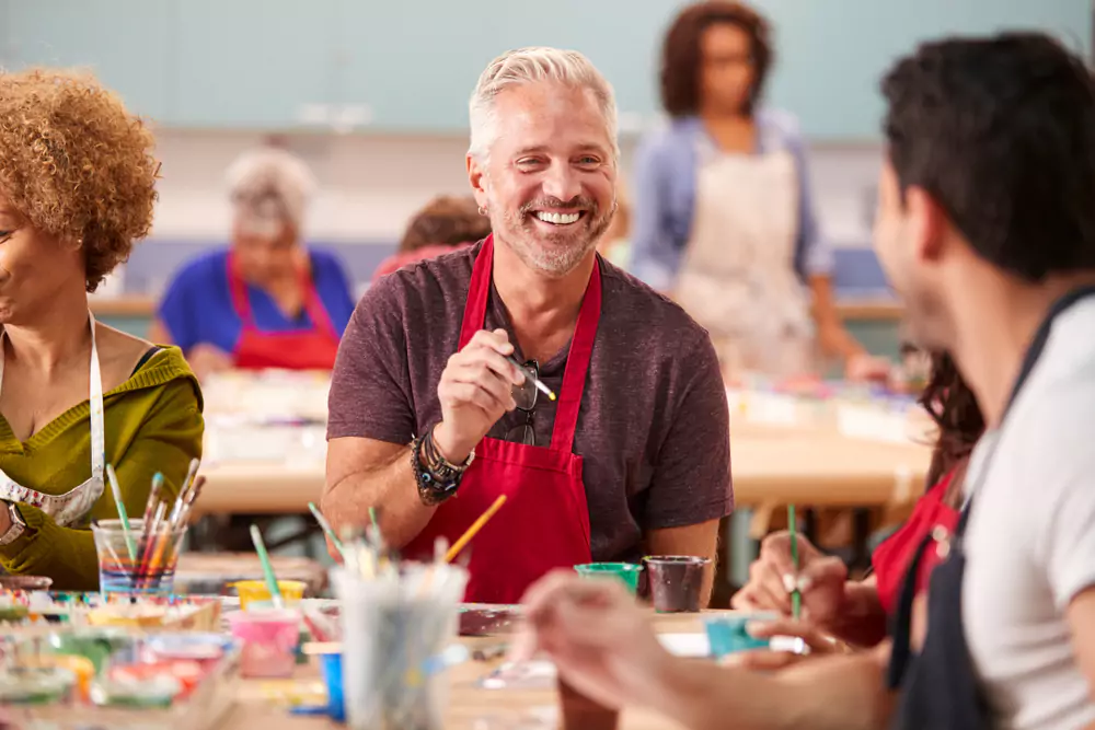 team members in art class