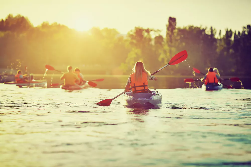 team members kayaking