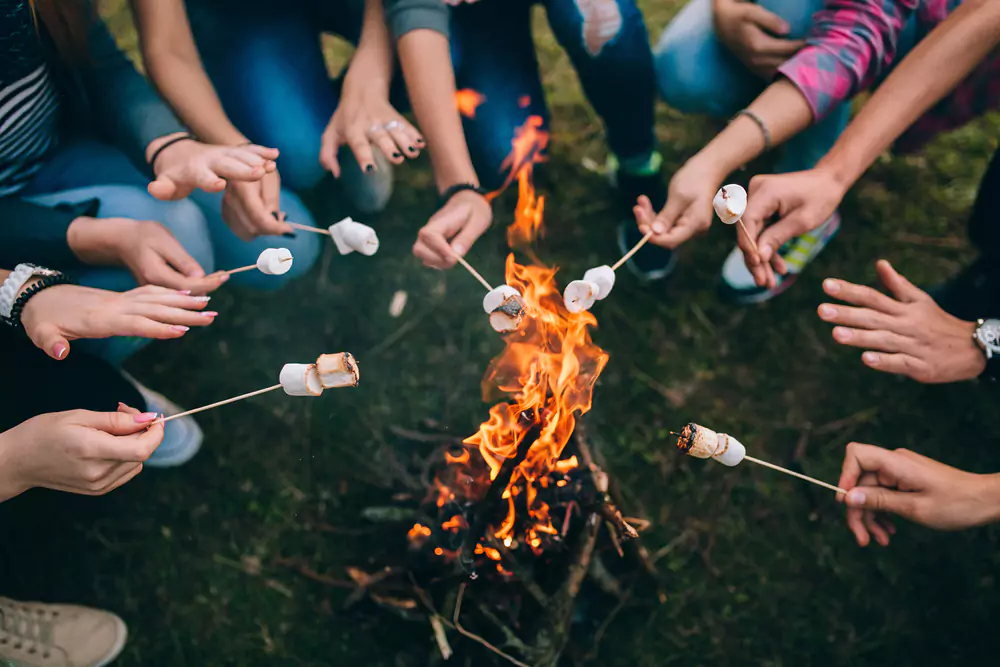 team members toasting marshmallows