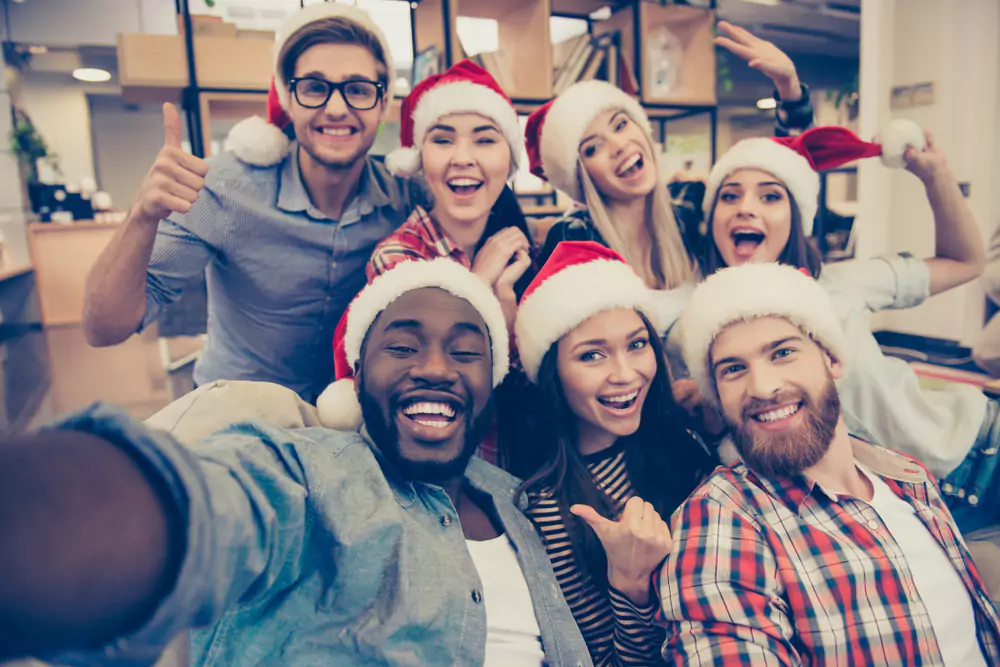 team members taking holiday selfie